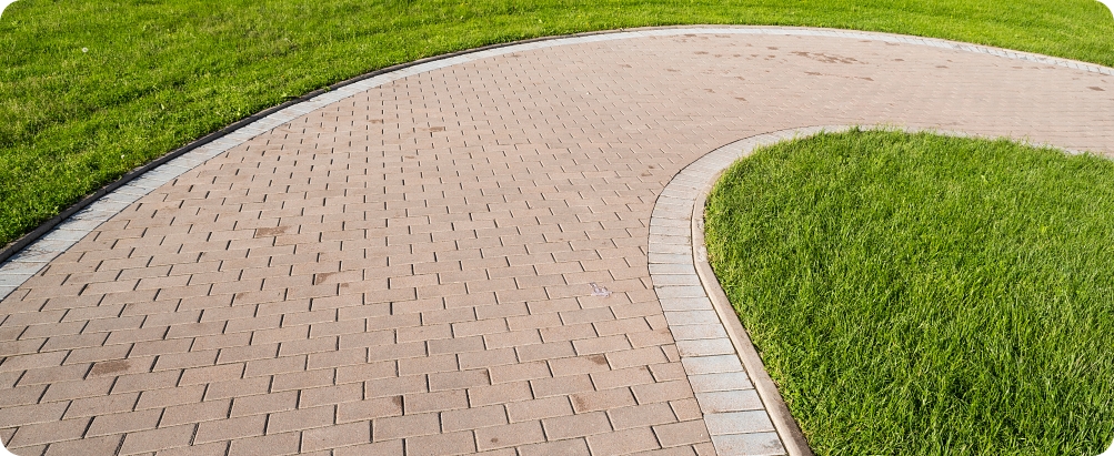curved stone walkway from pavers in landscape design and sidewalk decoration